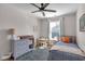 Comfortable bedroom featuring a twin bed, ceiling fan, and stylish furnishings at 1945 Carrollton Ave, Indianapolis, IN 46202