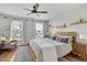 Comfortable bedroom features a ceiling fan, windows, and stylish decor at 1945 Carrollton Ave, Indianapolis, IN 46202
