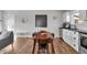 Charming dining area features modern decor, a table with seating, and seamlessly connects to the adjacent kitchen space at 1945 Carrollton Ave, Indianapolis, IN 46202