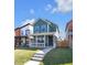 Charming two-story home with a covered porch and a well-maintained lawn, perfect for Gathering living at 1945 Carrollton Ave, Indianapolis, IN 46202
