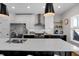 Modern kitchen with a central island, stainless steel appliances, and open floor plan at 1945 Carrollton Ave, Indianapolis, IN 46202