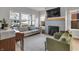 Bright living room with large windows, a cozy fireplace, and modern decor for comfortable living at 1945 Carrollton Ave, Indianapolis, IN 46202