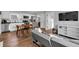 Open-concept living space with hardwood floors, a modern kitchen, and comfortable seating at 1945 Carrollton Ave, Indianapolis, IN 46202