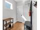 A functional mudroom area features shelving, coat hooks, and a bench for added convenience at 1945 Carrollton Ave, Indianapolis, IN 46202