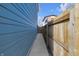 A concrete path between the house and a wooden fence offering additional privacy to the property at 1945 Carrollton Ave, Indianapolis, IN 46202