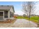 Backyard with patio space, lawn, and shed, offering a view of neighboring houses at 2054 Partridge Dr, Franklin, IN 46131