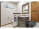 Bathroom features gray vanity with granite countertop, a decorative mirror and framed print at 2054 Partridge Dr, Franklin, IN 46131