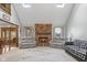 Bright living room features a brick fireplace, skylights, and comfortable seating arrangement at 2054 Partridge Dr, Franklin, IN 46131
