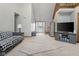 Open-concept living room with staircase, patterned rug, and comfortable furnishings for Gathering gatherings at 2054 Partridge Dr, Franklin, IN 46131