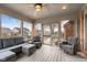 Comfortable screened-in porch with a ceiling fan and an assortment of seating options at 2054 Partridge Dr, Franklin, IN 46131