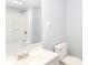 Clean bathroom with light gray vanity, toilet, and shower with a tub at 209 Pennsylvania St, Shirley, IN 47384