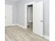 Bright bedroom with light-gray walls and wood-look floors and doorways at 209 Pennsylvania St, Shirley, IN 47384