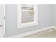 This cozy bedroom features a window providing natural light and light blue walls at 209 Pennsylvania St, Shirley, IN 47384