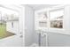Practical laundry room with double windows and utility hookups at 209 Pennsylvania St, Shirley, IN 47384