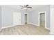 Spacious living room with multiple entryways and wood floors at 209 Pennsylvania St, Shirley, IN 47384