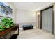 Hallway with decorative accent wall, a padded bench, and access to the elevator at 20971 Shoreline Ct # 309, Noblesville, IN 46062