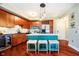 Updated kitchen featuring an island with stools, stainless appliances, and hardwood floors at 20971 Shoreline Ct # 309, Noblesville, IN 46062