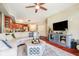 Spacious living room features hardwood floors, neutral tones, and a modern entertainment center at 20971 Shoreline Ct # 309, Noblesville, IN 46062