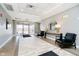A bright lobby area with an outside view, a round mirror and black chairs at 20971 Shoreline Ct # 309, Noblesville, IN 46062