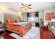 Bright main bedroom with a ceiling fan, a decorative headboard, and a large window at 20971 Shoreline Ct # 309, Noblesville, IN 46062