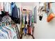 Organized walk-in closet featuring hanging storage for clothing, handbags, and accessories at 20971 Shoreline Ct # 309, Noblesville, IN 46062
