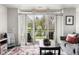 Balcony featuring chairs, table and view of green space through sliding glass doors at 20971 Shoreline Ct # Apt 212, Noblesville, IN 46062