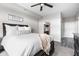 Bright bedroom featuring a king-size bed and attached Primary bathroom with a doorway at 20971 Shoreline Ct # Apt 212, Noblesville, IN 46062