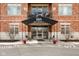 The condo entrance has a covered awning, glass doors, and a designated fire lane for safety and convenience at 20971 Shoreline Ct # Apt 212, Noblesville, IN 46062