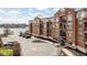 Beautiful condo building with red brick, balconies, and lake view offers ample parking and convenient amenities at 20971 Shoreline Ct # Apt 212, Noblesville, IN 46062