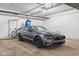 Garage featuring a gray car and a bicycle next to a door at 20971 Shoreline Ct # Apt 212, Noblesville, IN 46062