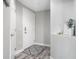 Bright condo hallway with white doors, modern decor, and elegant flooring providing a clean and inviting space at 20971 Shoreline Ct # Apt 212, Noblesville, IN 46062