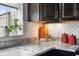 Kitchen corner showcasing decorative backsplash and a white marble countertop at 20971 Shoreline Ct # Apt 212, Noblesville, IN 46062