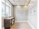 Hallway view of resident mailboxes, package drop, storage, tile floors and natural light from large windows at 20971 Shoreline Ct # Apt 212, Noblesville, IN 46062