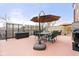 Outdoor patio with dining set and umbrella with a seating area and sunflowers at 20971 Shoreline Ct # Apt 212, Noblesville, IN 46062