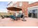 Outdoor patio with dining table, chairs, and umbrella, perfect for gatherings at 20971 Shoreline Ct # Apt 212, Noblesville, IN 46062