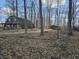 Wooded property featuring a house and barn, set amongst mature trees, offering country living at 21977 Craig Ave, Noblesville, IN 46060