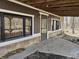 Exterior view of home showing access to the crawlspace and an outdoor living space at 21977 Craig Ave, Noblesville, IN 46060