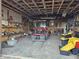 View of the garage interior with a tractor and assorted tools at 21977 Craig Ave, Noblesville, IN 46060