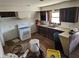 A traditional kitchen featuring wooden cabinets, appliances, and laminate floors at 21977 Craig Ave, Noblesville, IN 46060