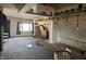 A spacious living room with unfinished floors and a rustic-style fireplace at 21977 Craig Ave, Noblesville, IN 46060