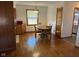Cozy dining room features hardwood floors, a simple light fixture, and a view from the window at 2309 Dover St, Anderson, IN 46013