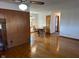 Dining room features hardwood floors, light fixture, and is open to other rooms of the home at 2309 Dover St, Anderson, IN 46013