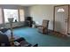Cozy living room with a neutral color scheme, plush carpet, and an abundance of natural light at 2309 Dover St, Anderson, IN 46013