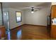 Bright living room with hardwood floors and natural light, transitioning seamlessly into the dining area at 2309 Dover St, Anderson, IN 46013