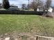 A spacious backyard with a wooden fence and green grass at 238 S Main St, Wilkinson, IN 46186