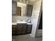 A bathroom with a sink, vanity and tiled walls at 238 S Main St, Wilkinson, IN 46186