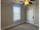This bedroom has a ceiling fan, window and closet at 238 S Main St, Wilkinson, IN 46186