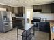 Updated kitchen featuring stainless steel appliances, wooden countertops, and ceramic tile floors at 238 S Main St, Wilkinson, IN 46186