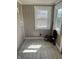 Utility room with tiled floors and a window at 238 S Main St, Wilkinson, IN 46186