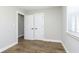 Bright, airy bedroom with a window and a closet at 240 E Caven E St, Indianapolis, IN 46225